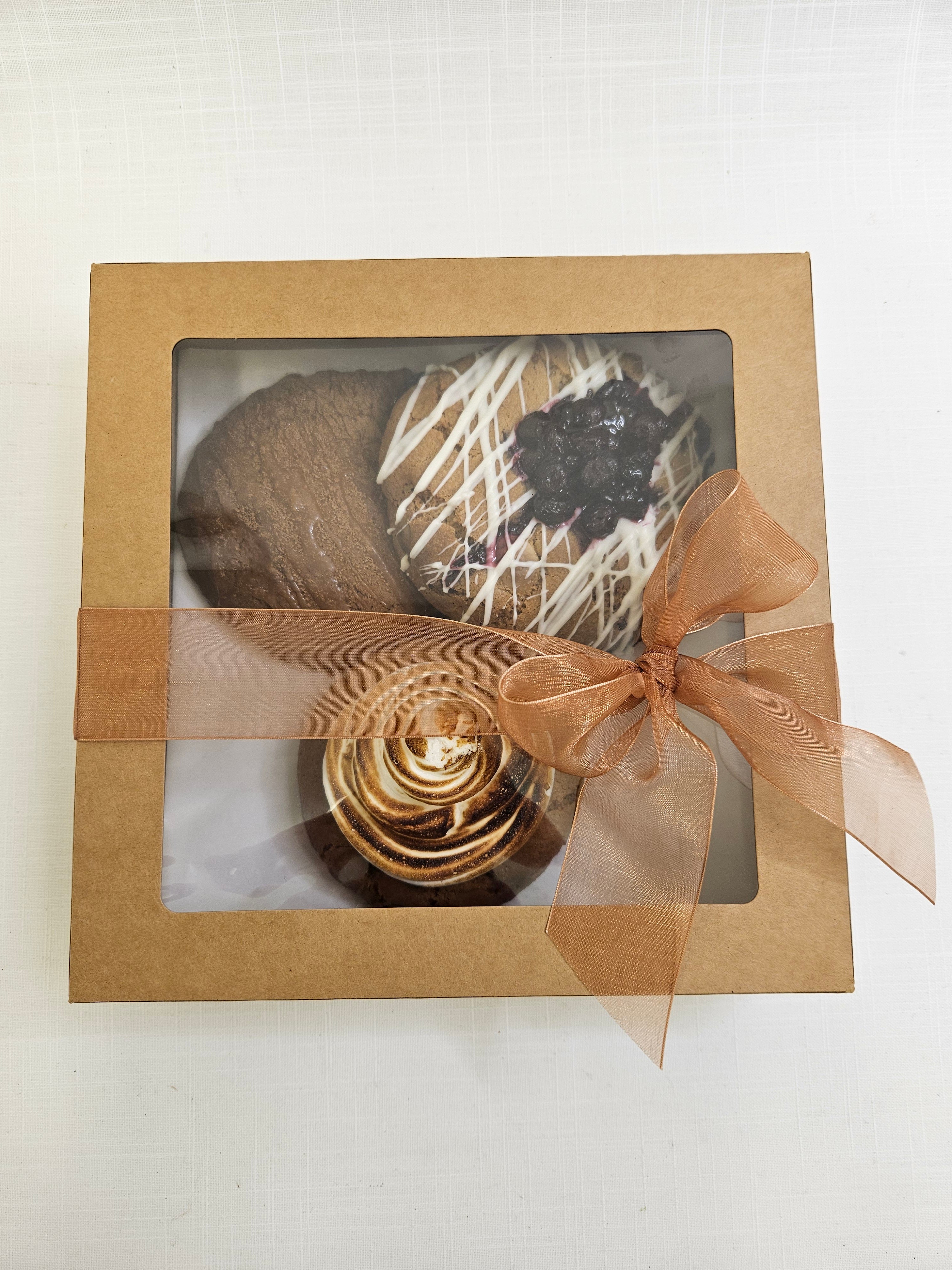 Boujee Bird Biscuit Box with three hand-made cookies in various flavours packaged in a brown carry-box.