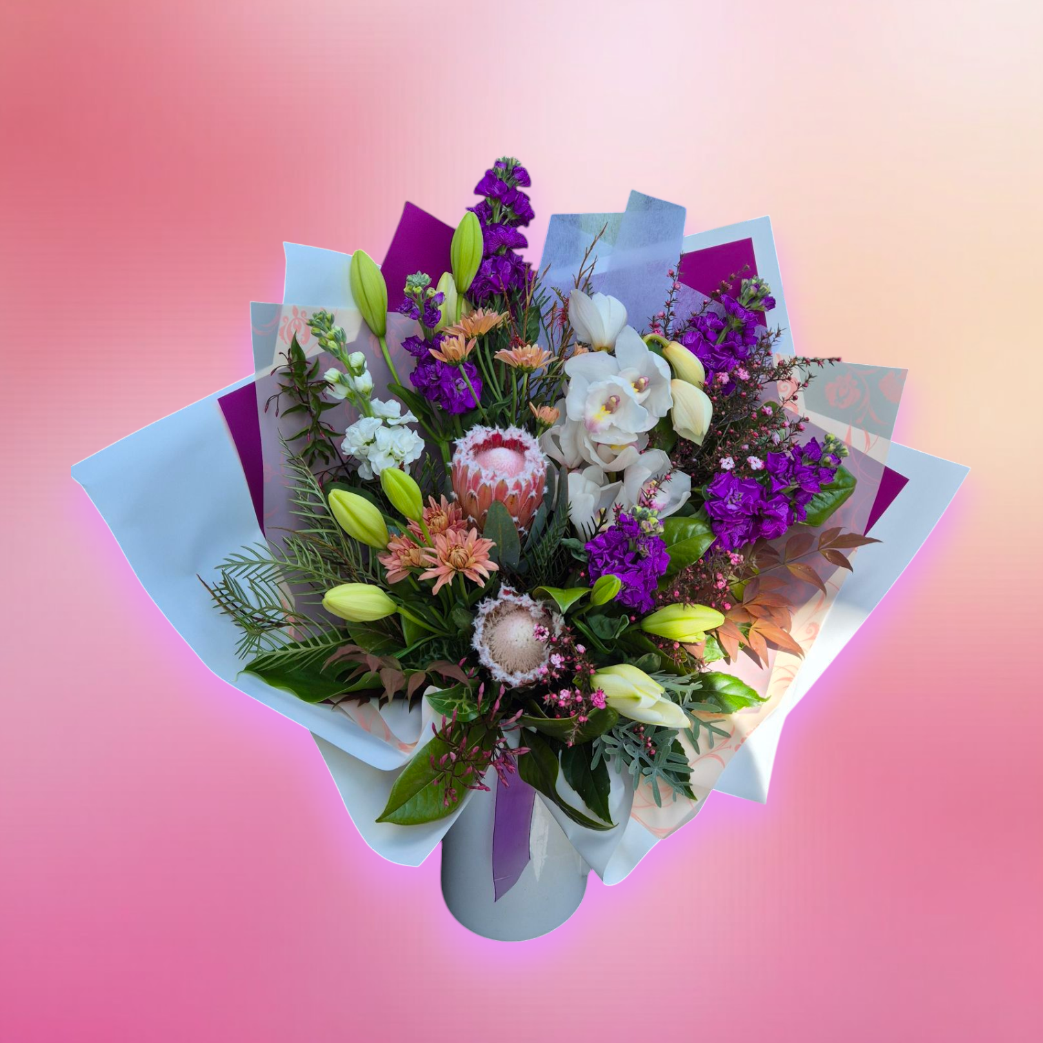Petal Parade - Bright & Bold floral bouquet made with a variety of brightly coloured flower and foliage, wrapped in matching paper.