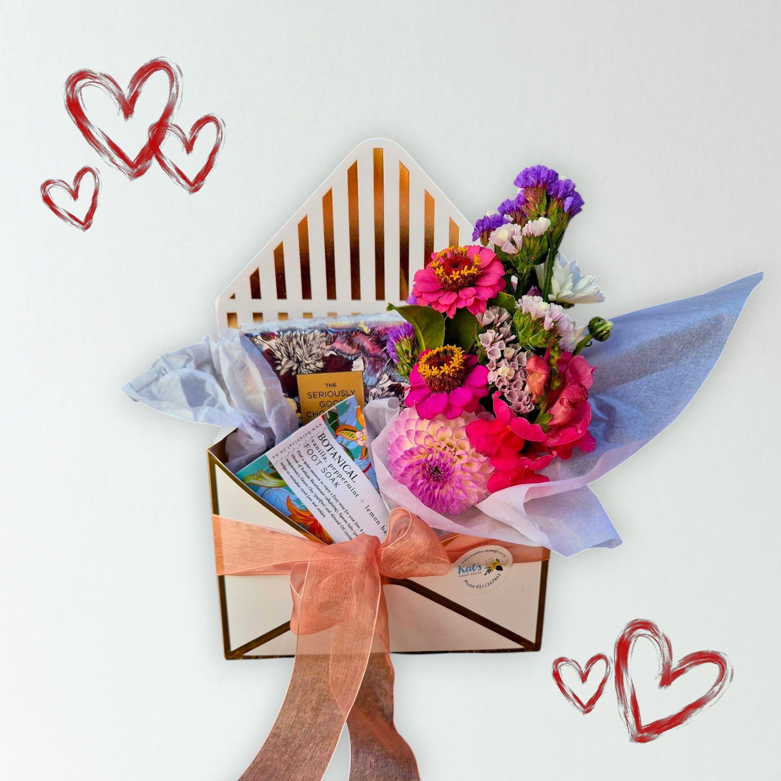 Envelope of Love & Blooms gift box containing a small bunch of flowers, a Botanical Foot Soak and bar of Seriously Good Chocolate. Perfect for Mother&