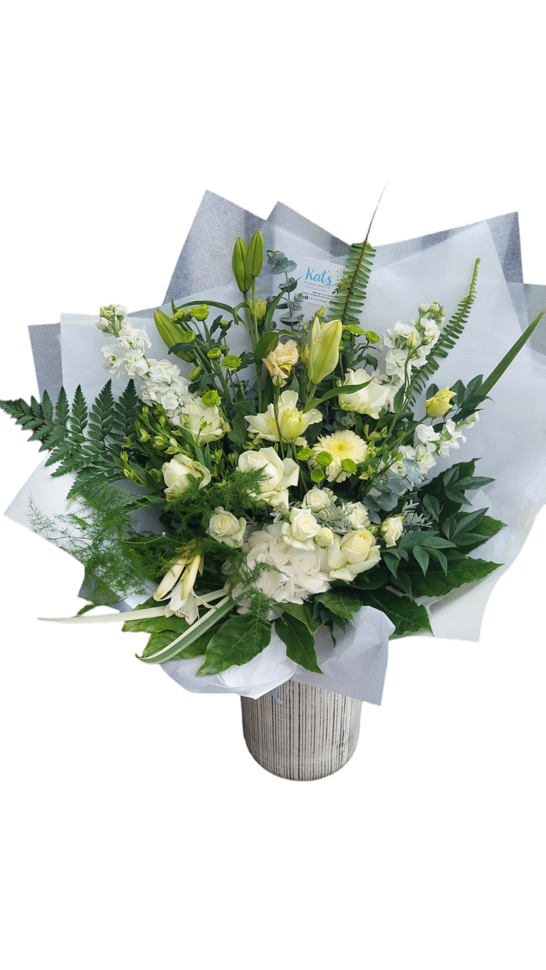 Sympathy Flowers bouquet in Large size made with soft white flowers and foliage, wrapped in white paper.