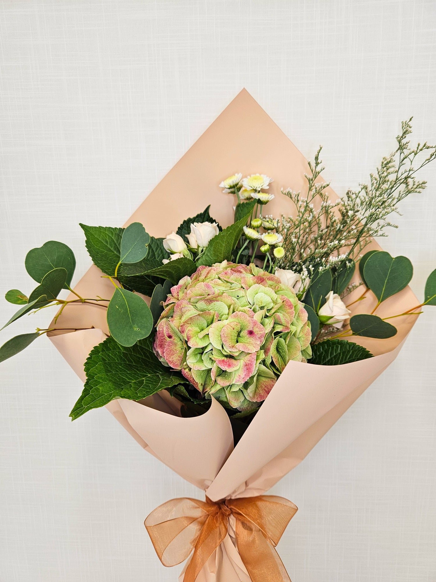 fleurs florist logo in a classic serif font, with a dark pink flower illustration.