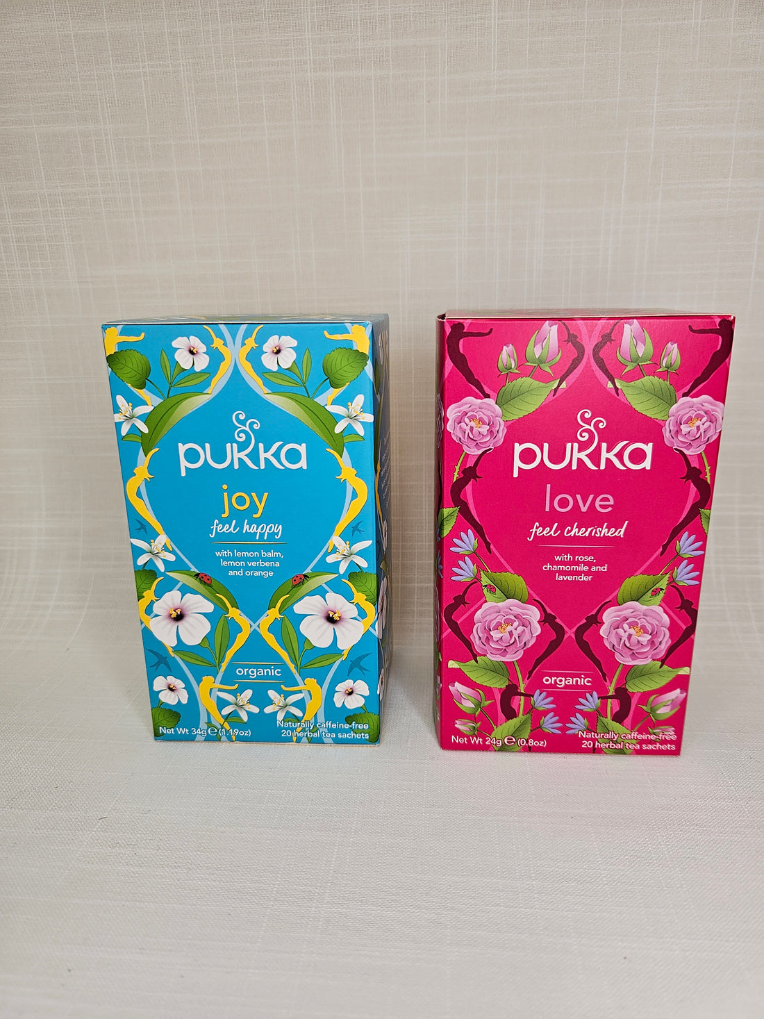 Two boxes of Pukka Tea, in flavours Love and Joy. 