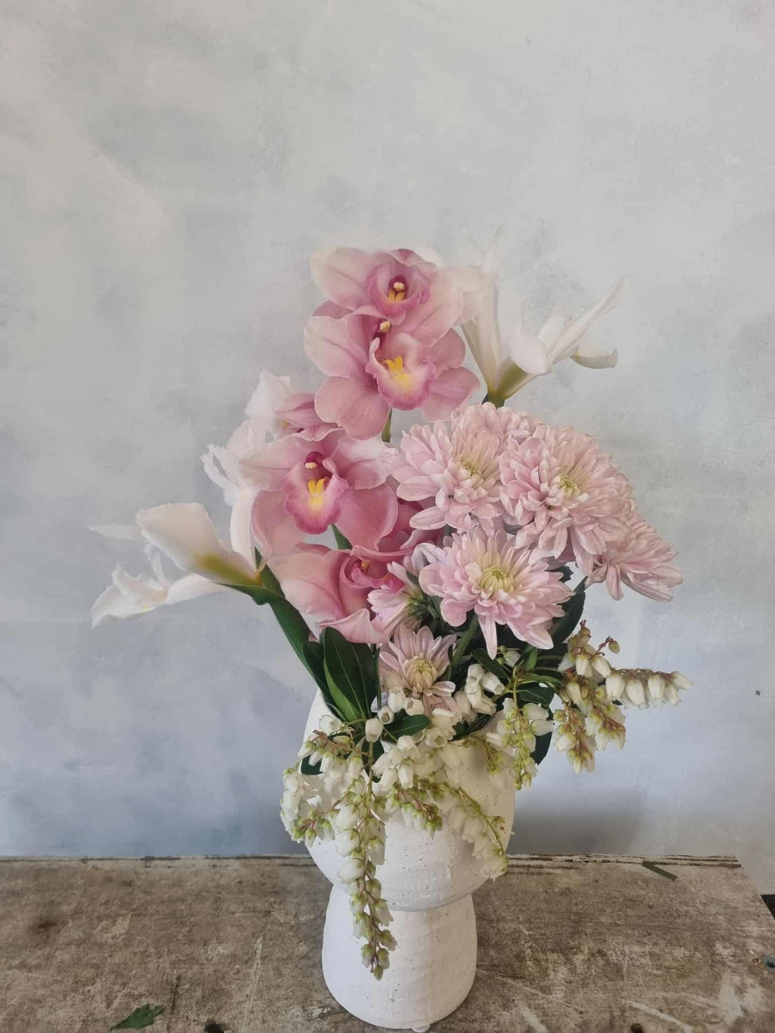 Hey Mama Gift Box containing a soft pastel floral bouquet in ceramic pedestal vase.