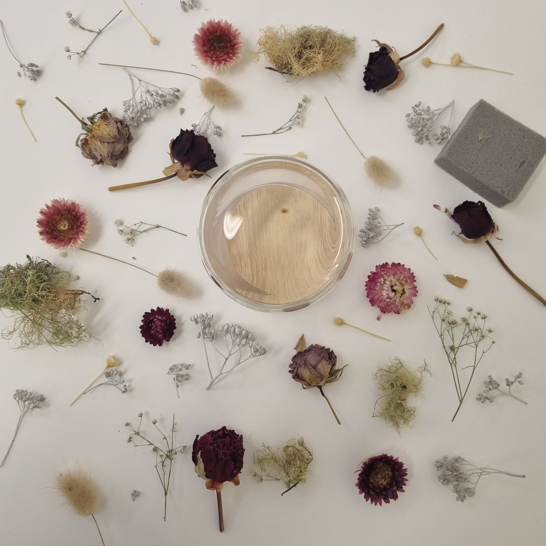 Arrangement of the Floral Dome Kit components, including dried flowers, foliage and other supplies.