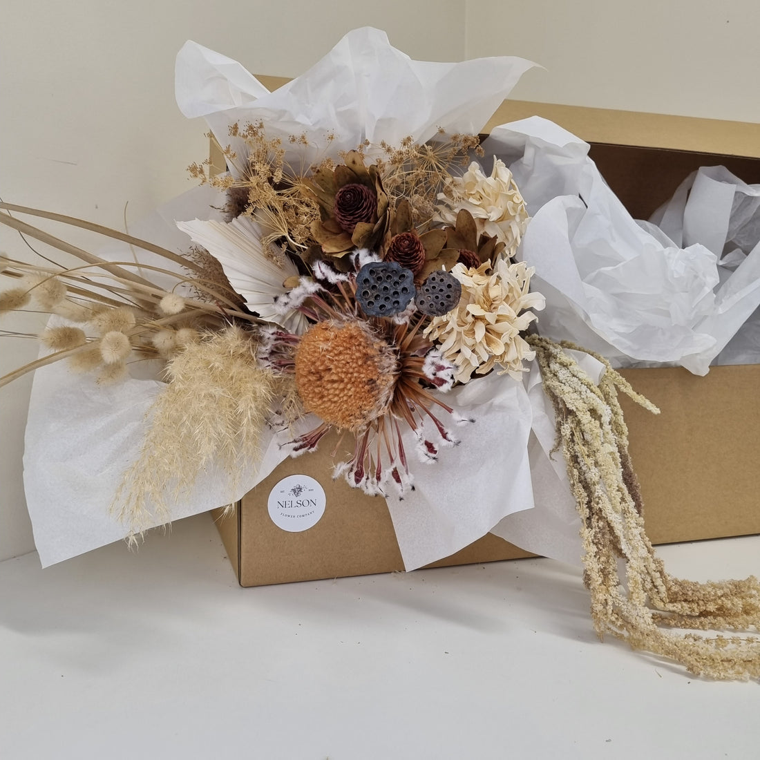 Naturally Neutral Dried Flower Box in cardboard box with white tissue paper.