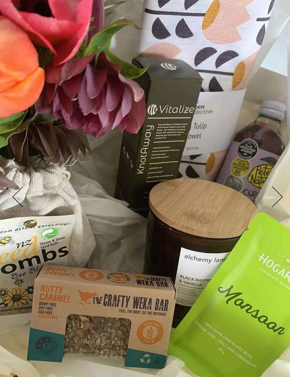 Lux Gift Box - Gluten Free, complete with Alchemy Lane candle, The Green Collective tea towel, Seed Bombs Flower Blend, Crafty Weka Gluten Free Nutty Caramel Bar, Hogarths Monsoon chocolate bar, Pete&