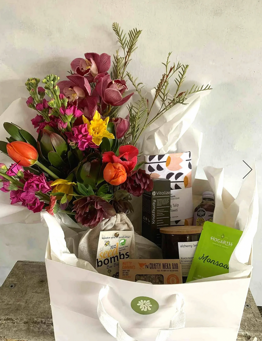 Lux Gift Box - Gluten Free, complete with Alchemy Lane candle, The Green Collective tea towel, Seed Bombs Flower Blend, Crafty Weka Gluten Free Nutty Caramel Bar, Hogarths Monsoon chocolate bar, Pete&