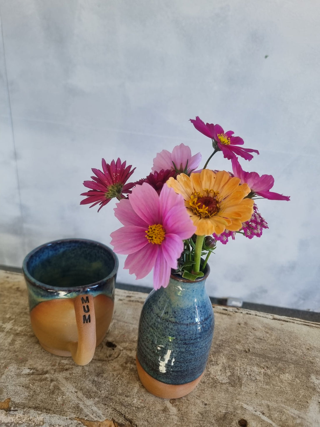 MOTHER gift basket complete with seasonal floral posie, a handmade pottery mug with MUM written on the handle, a small pottery vase, Botanical Hand Cream, and bar of Hogarth&